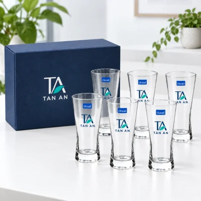Minh họa sáu ly Ocean B21312 cùng hộp xanh đậm có nhận diện TAN AN