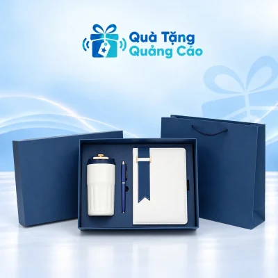 Minh họa bộ sổ trắng xanh, bình nắp xanh và bút trong hộp, kèm túi giấy xanh
