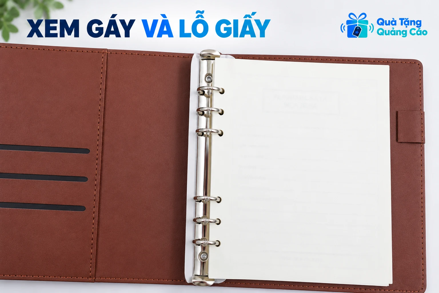 Cận sáu vòng kim loại và lỗ giấy trên mẫu sổ gáy vòng nâu