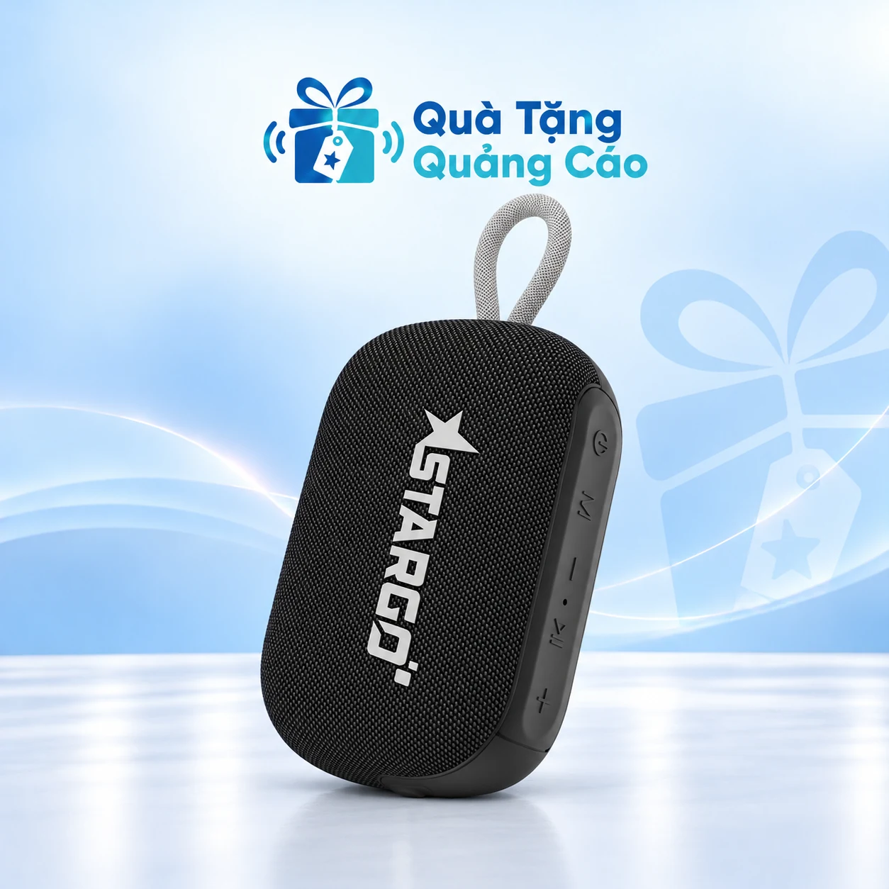 Loa Wave Mini đen trên nền thương hiệu Loa StarGO Wave Mini đen bọc vải có dây treo xám trên nền xanh nhạt