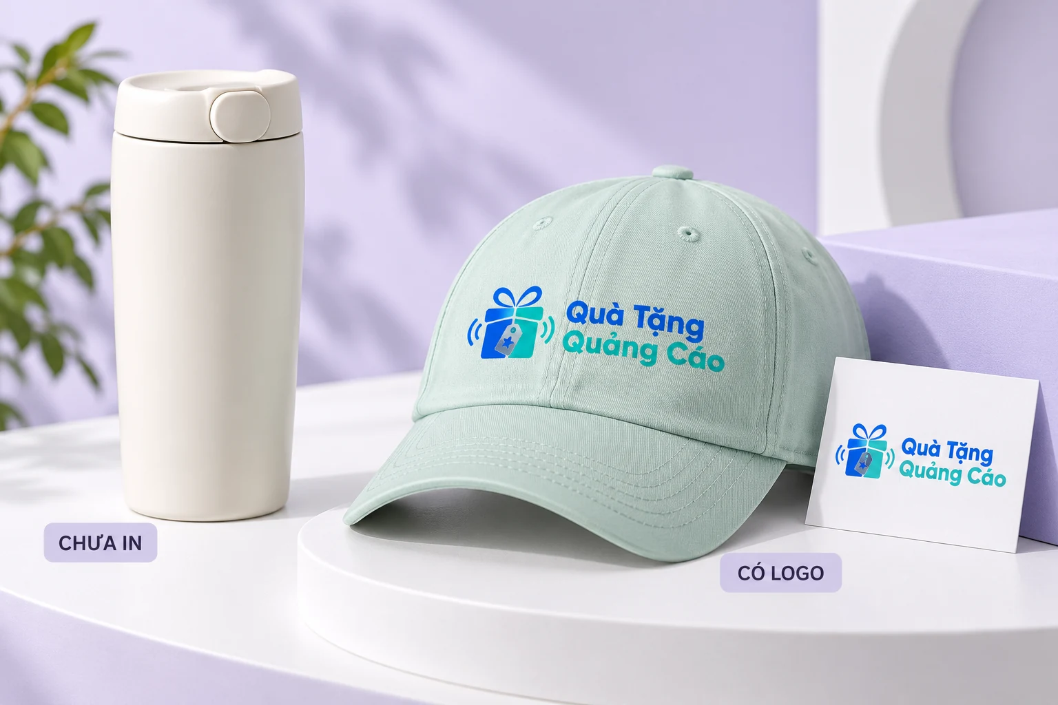 Ly giữ nhiệt chưa in cạnh mũ xanh mint có logo Quà Tặng Quảng Cáo và thẻ nhận diện