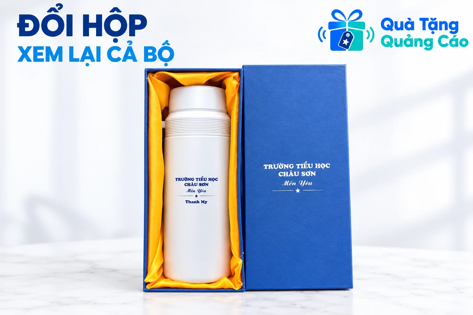 Bình trắng trong hộp xanh lót vàng cùng nắp hộp rời đúng ảnh nguồn